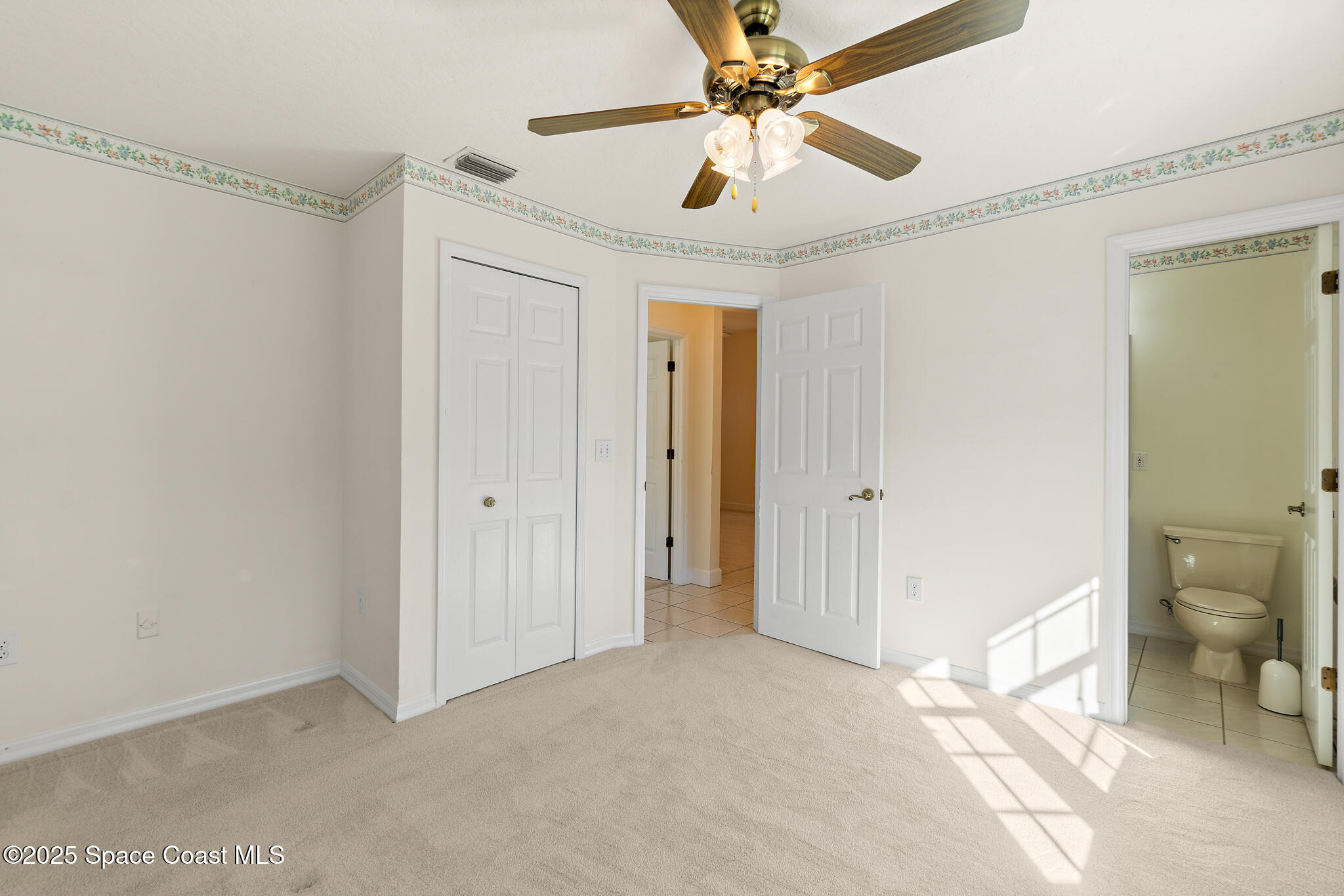 427 Hurst Road Northeast Palm Bay, FL 32907 - Photo 50 of 81 a view of a big room with wooden floor and windows in a room