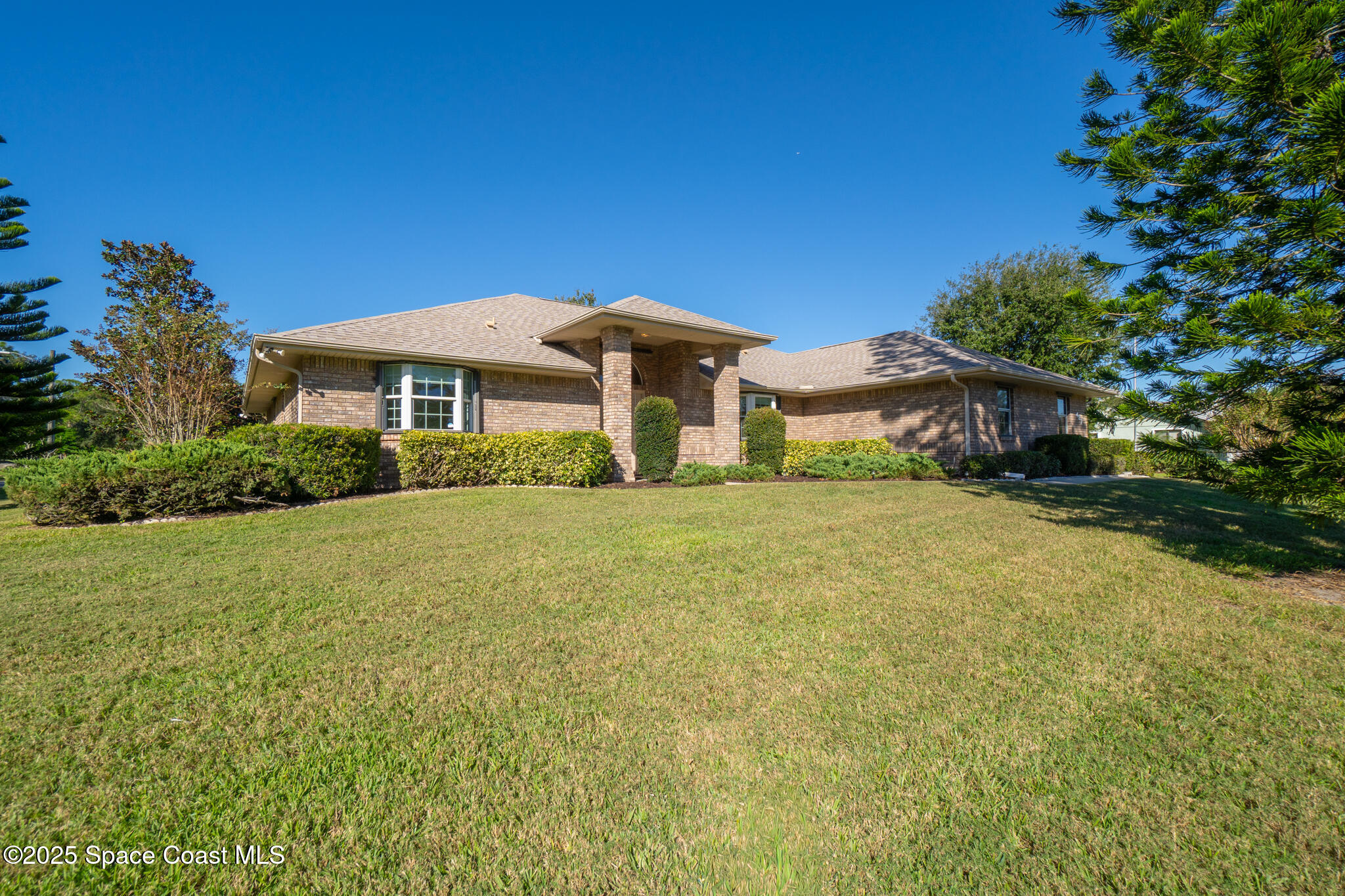 427 Hurst Road Northeast Palm Bay, FL 32907 - Photo 57 of 81 a front view of a house with a yard