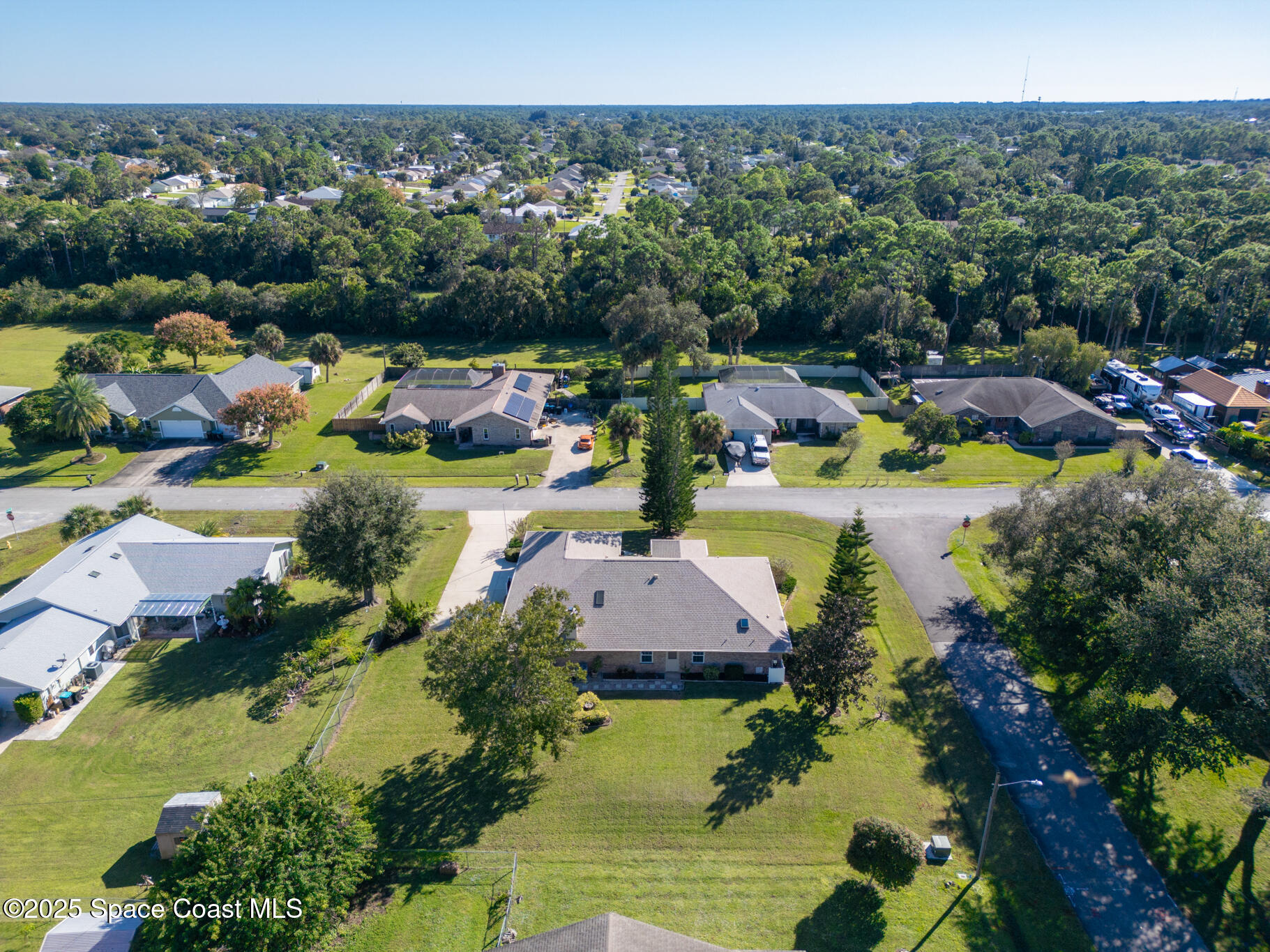 427 Hurst Road Northeast Palm Bay, FL 32907 - Photo 6 of 81 an aerial view of a house with a garden