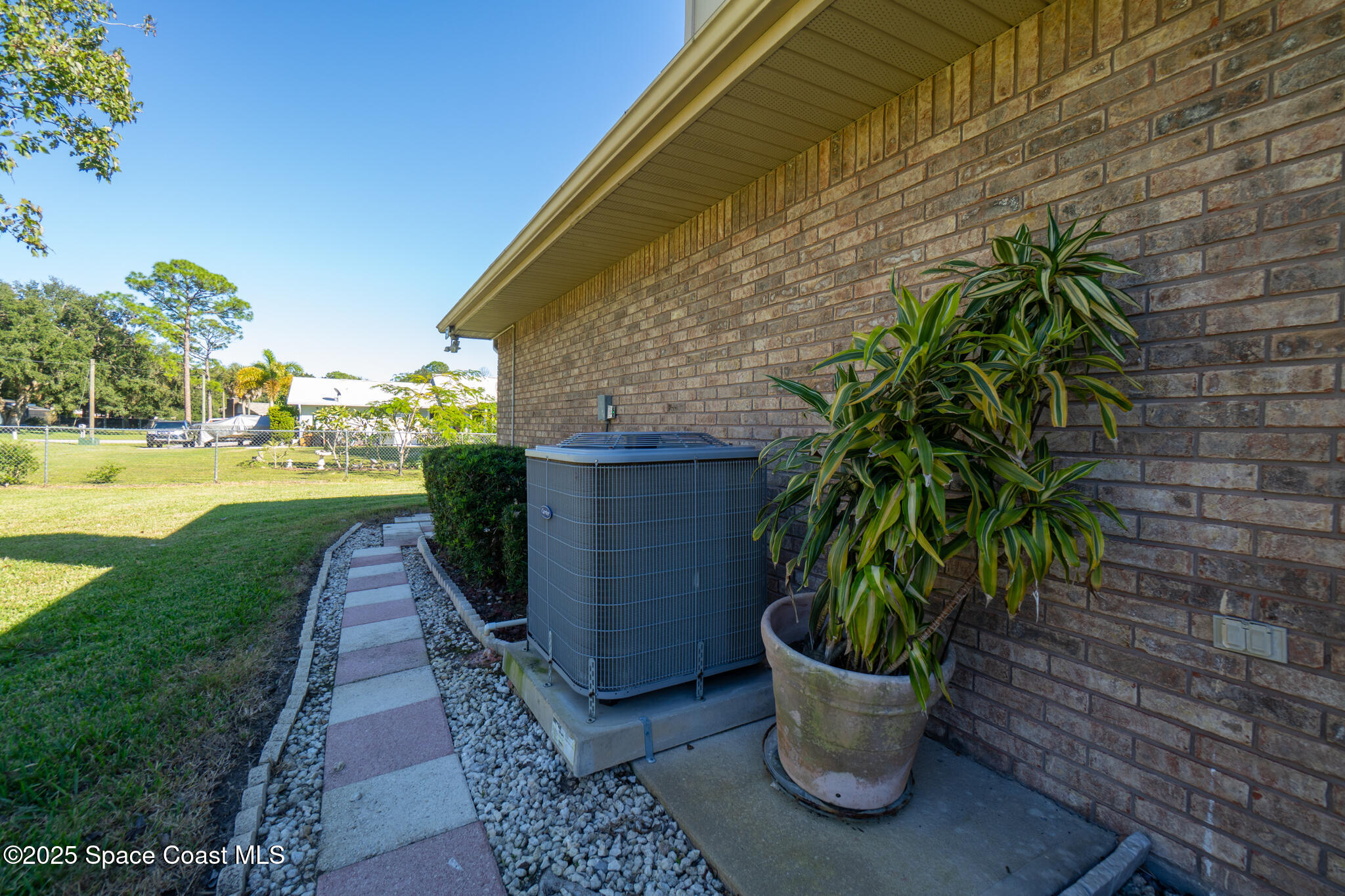 427 Hurst Road Northeast Palm Bay, FL 32907 - Photo 67 of 81 a view of a back yard of the house with a garden