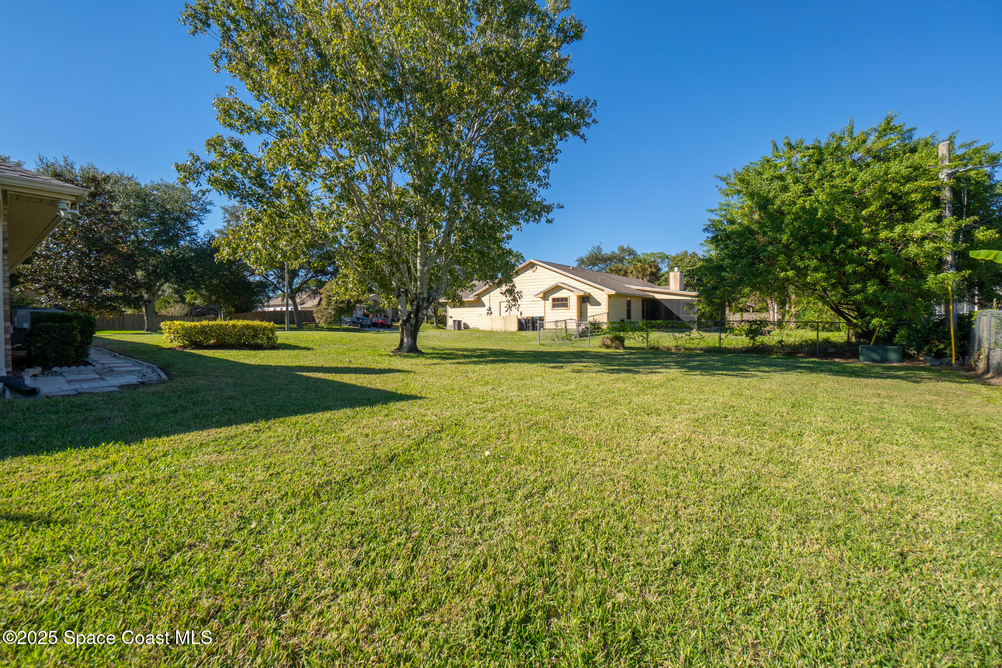 427 Hurst Road Northeast Palm Bay, FL 32907 - Photo 68 of 81 a view of an outdoor space and yard