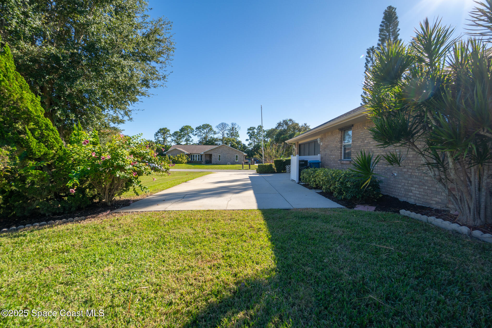 427 Hurst Road Northeast Palm Bay, FL 32907 - Photo 69 of 81 a view of a garden with an outdoor space