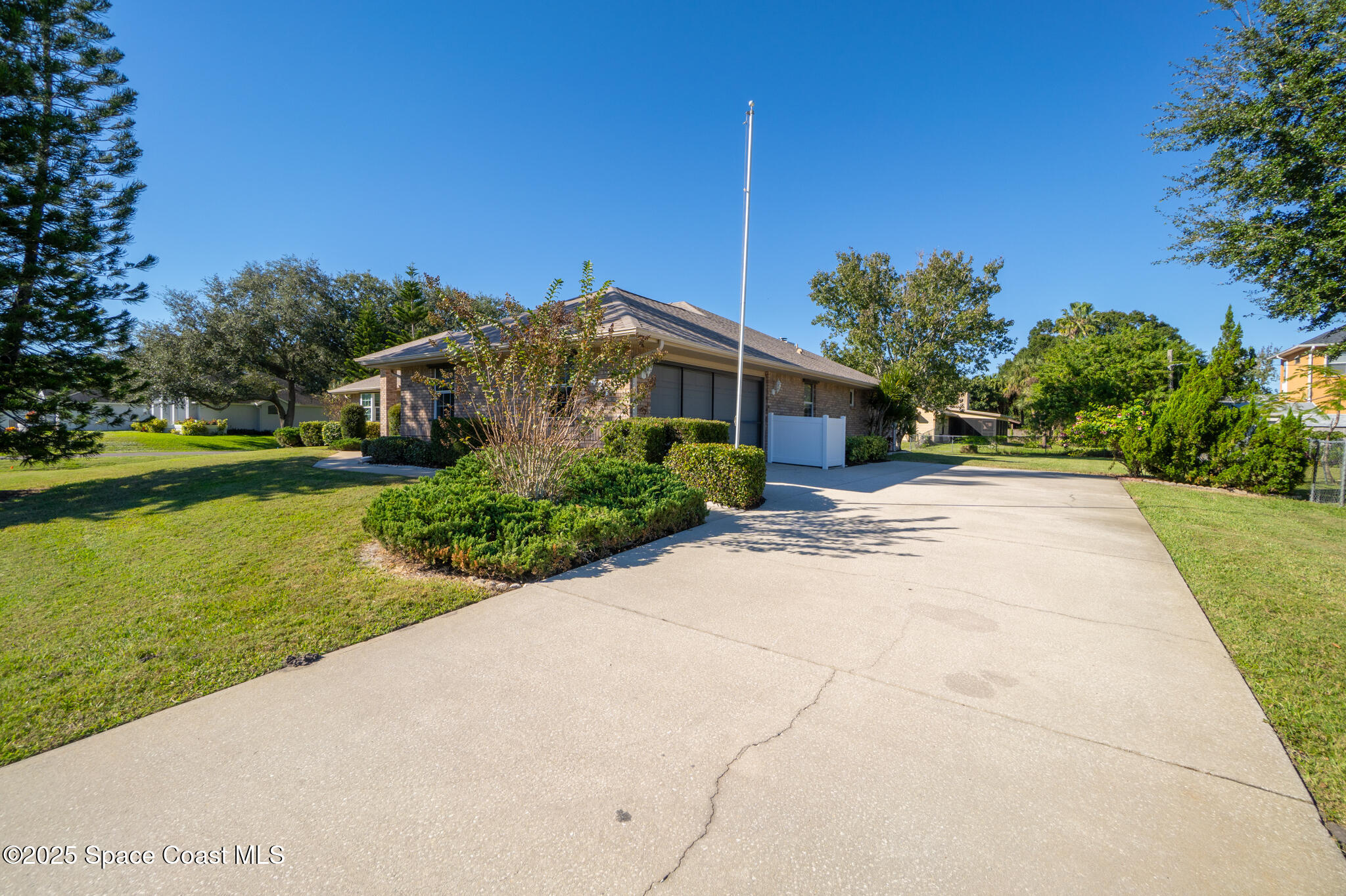427 Hurst Road Northeast Palm Bay, FL 32907 - Photo 10 of 81 a front view of a house with garden