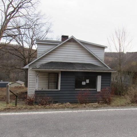 3097 Seanor Road Hollsopple, PA 15935 - Photo 1 of 15 a front view of a house with a yard and garage