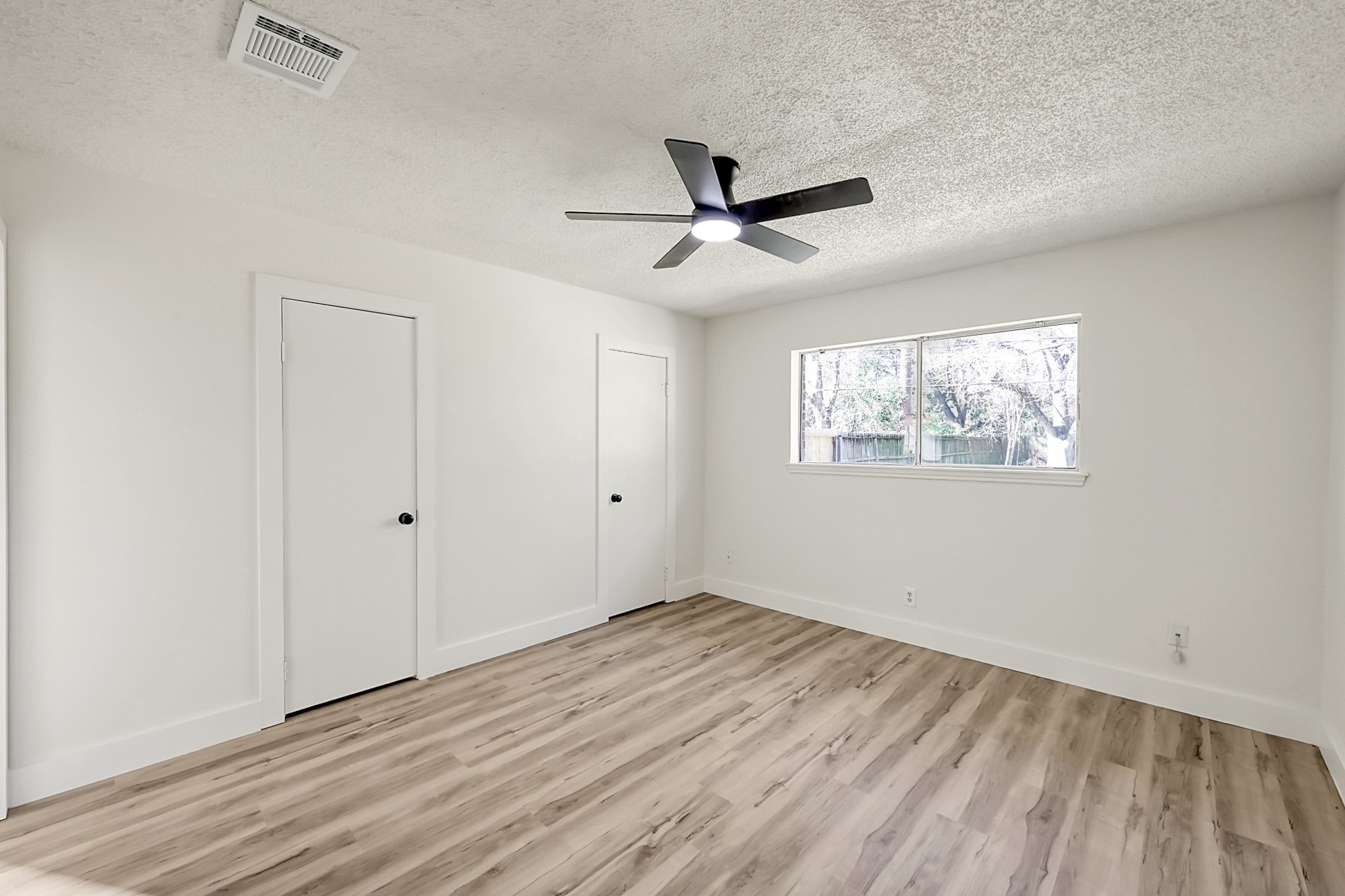 29615 Brookchase Drive Spring, TX 77386 - Photo 15 of 24 Primary bedroom faces the back of the home complete with a his and her closet and en-suite bathroom.