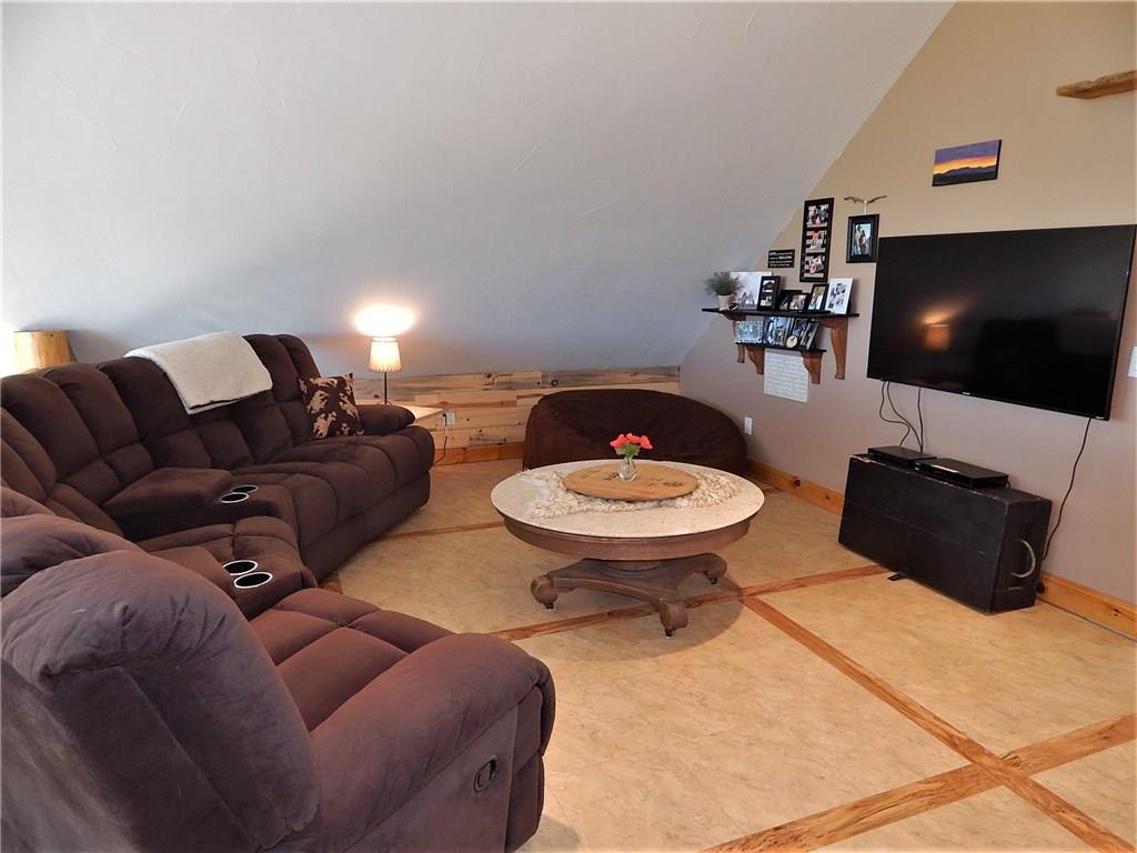 1182 Sheep Ridge Road Fairplay, CO 80440 - Photo 22 of 35 a living room with furniture and a flat screen tv