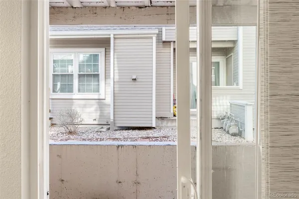a view of a door and a kitchen