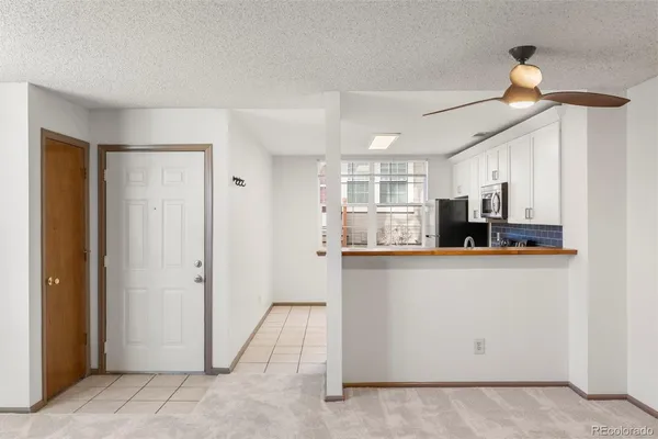 a kitchen with stainless steel appliances a refrigerator and a stove top oven