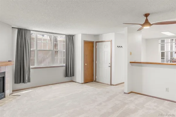 an empty room with windows and closet