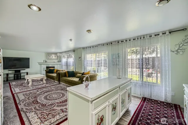 a living room with furniture and a rug