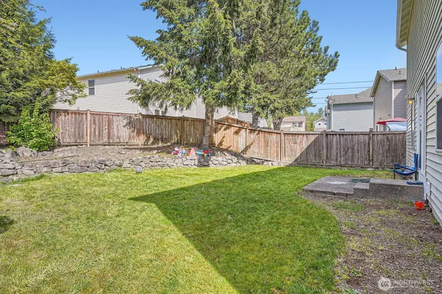 a view of a backyard with a slide