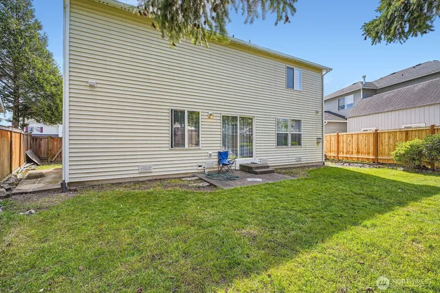 a view of a backyard with a garden and plants