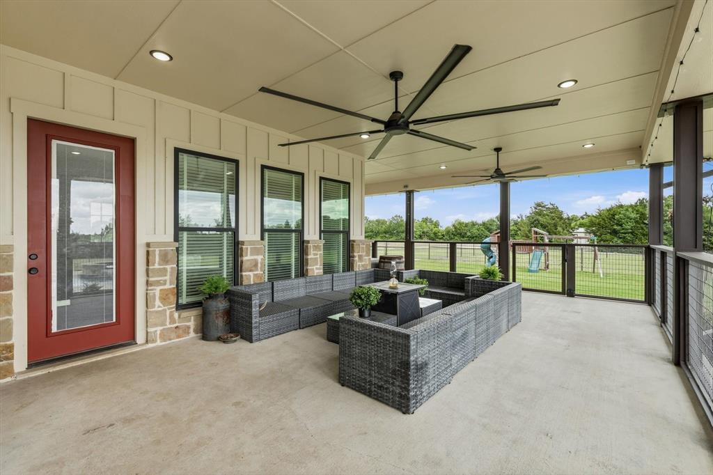 6020 Honeysuckle Road Midlothian, TX 76065 - Photo 26 of 39 Expansive covered patio featuring a concrete floor, recessed lighting, and two ceiling fans
