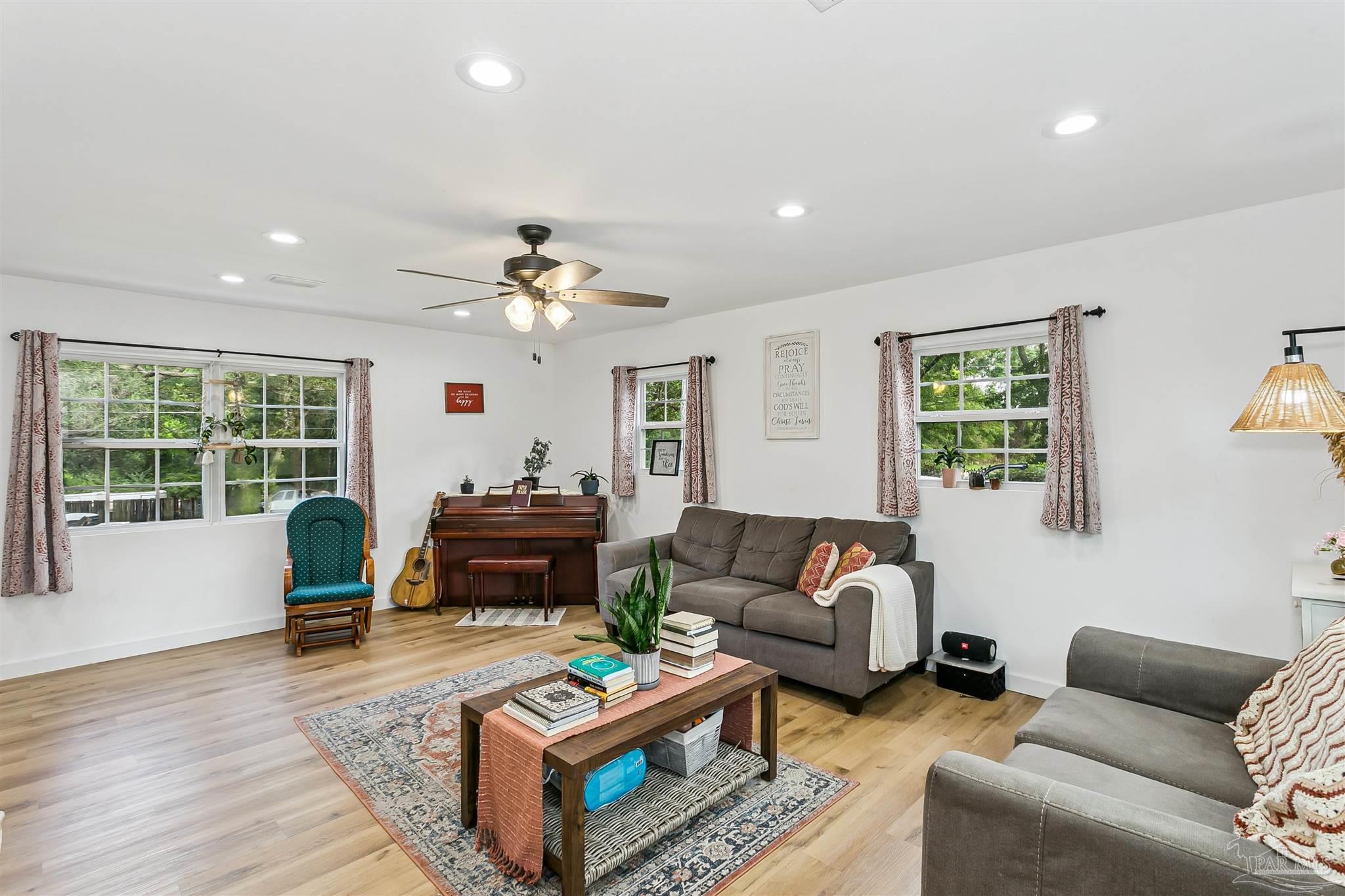 1095 River Annex Road Cantonment, FL 32533 - Photo 13 of 32 a living room with furniture and a window