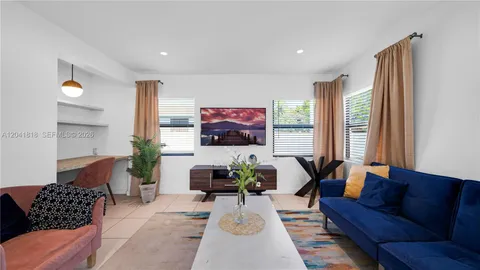a living room with furniture and a couch