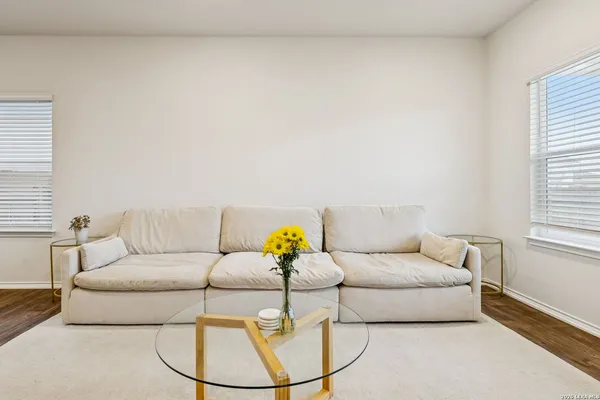 a living room with furniture and a window