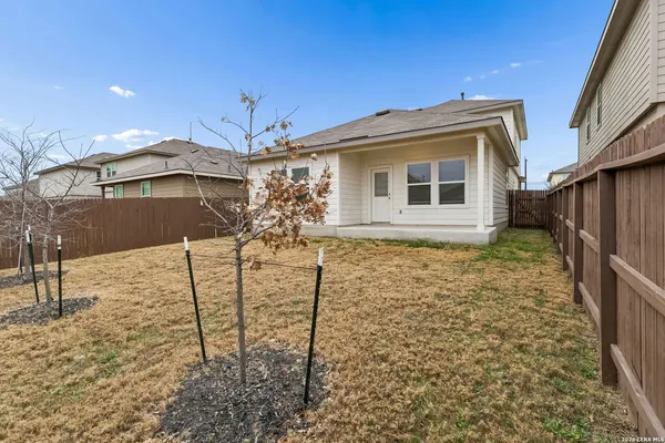 a view of house with yard