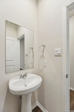 a bathroom with a sink and a mirror