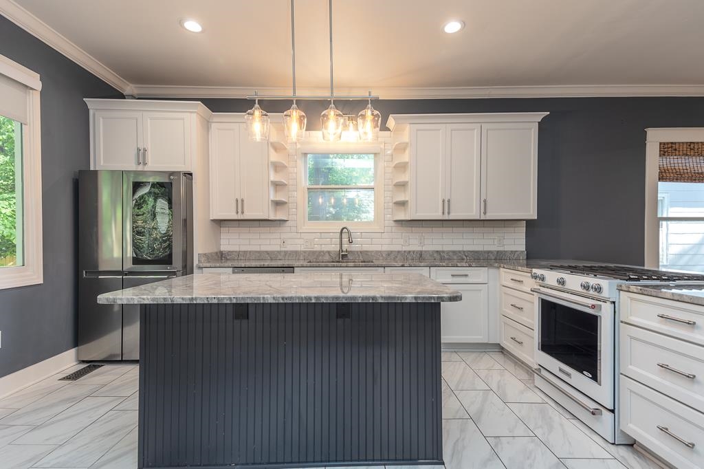 119 South Fenwick Road Memphis, TN 38111 - Photo 18 of 28 a kitchen with a sink stove and cabinets