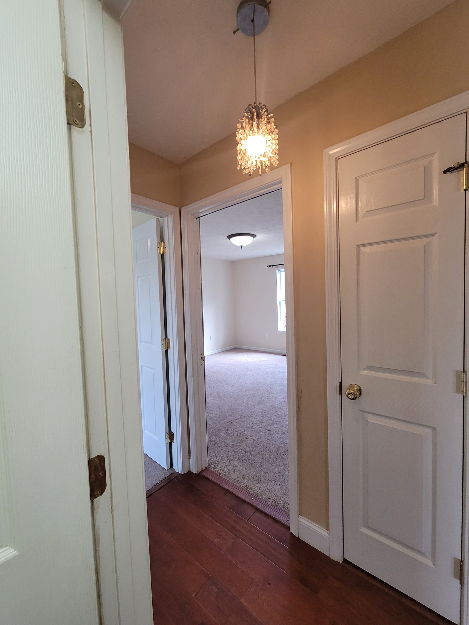 137 Sudberry Road Bell Buckle, TN 37020 - Photo 35 of 39 wooden floor in an empty room with a mirror