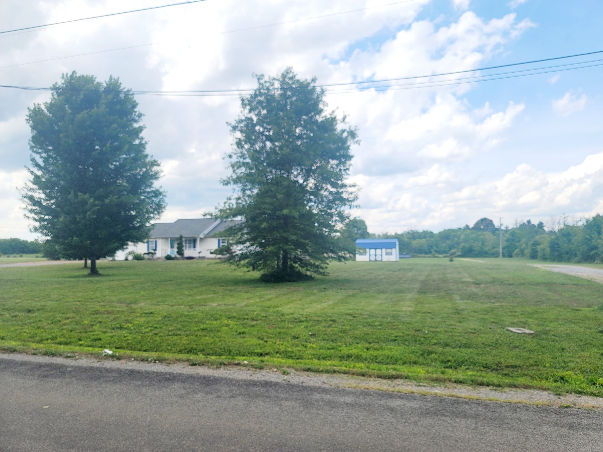 137 Sudberry Road Bell Buckle, TN 37020 - Photo 6 of 39 a view of a big yard with a house
