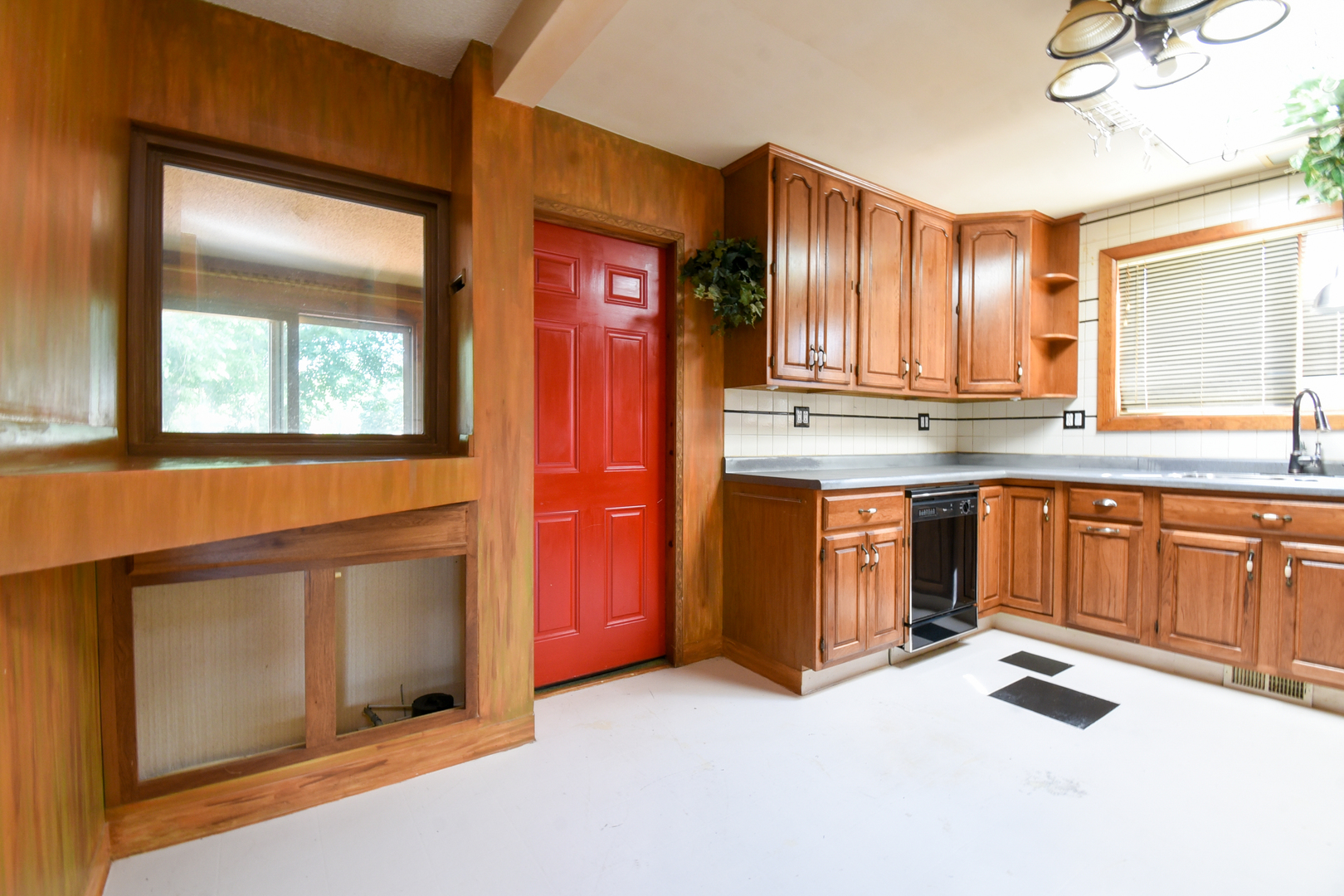 206 Circle Road Fox River Grove, IL 60021 - Photo 13 of 40 a kitchen with stainless steel appliances granite countertop a stove a sink and a microwave