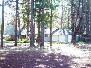 44893 Pine Shadows Road McArthur, CA 96056 - Photo 3 of 15 a view of a house with a yard and tree s