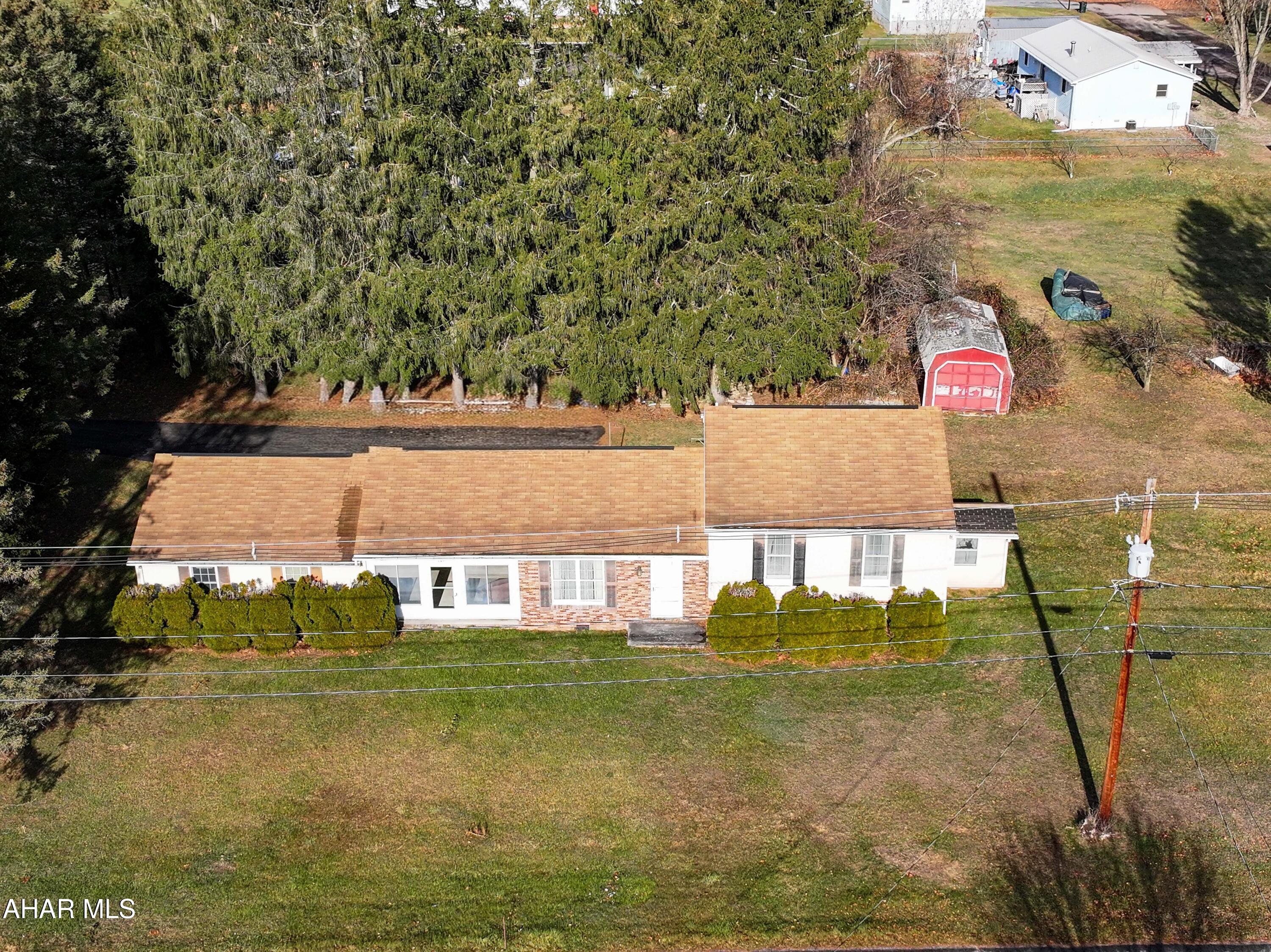 147 Pine Street Hyndman, PA 15545 - Photo 29 of 44 a view of swimming pool of water with lawn chairs and plants