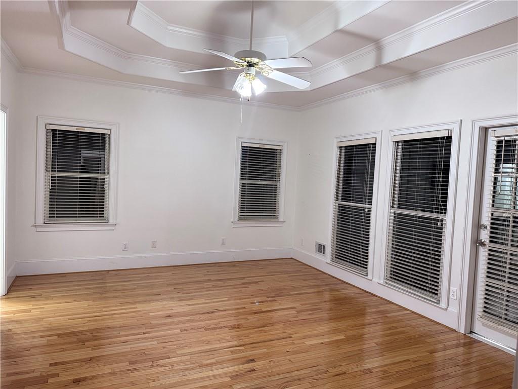 115 Parkview Trace Pass Southwest Lilburn, GA 30047 - Photo 17 of 19 an empty room with wooden floor and windows