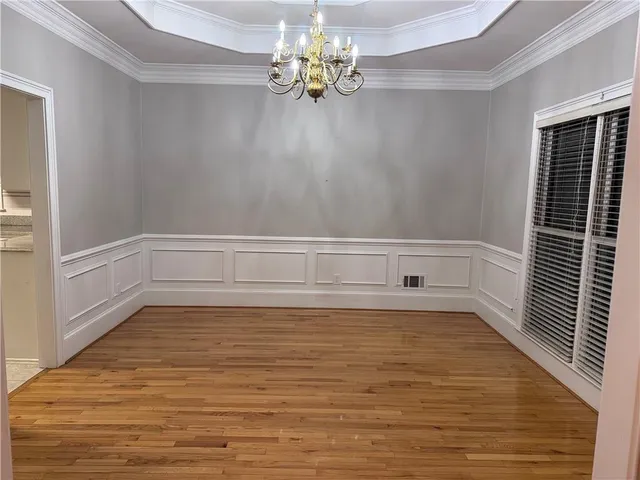 a view of bathroom with bathtub and wooden floor