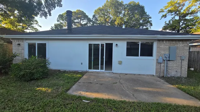 a front view of a house with a garden and garage