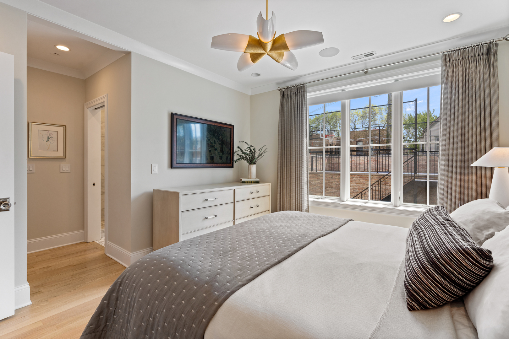 1025 West Altgeld Street Chicago, IL 60614 - Photo 18 of 41 a spacious bedroom with a bed and a flat screen tv