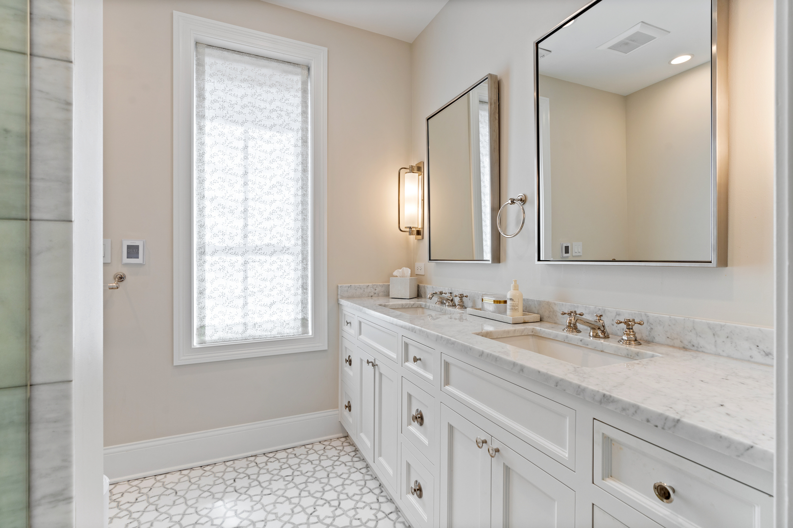 1025 West Altgeld Street Chicago, IL 60614 - Photo 19 of 41 a bathroom with double sink and a mirror