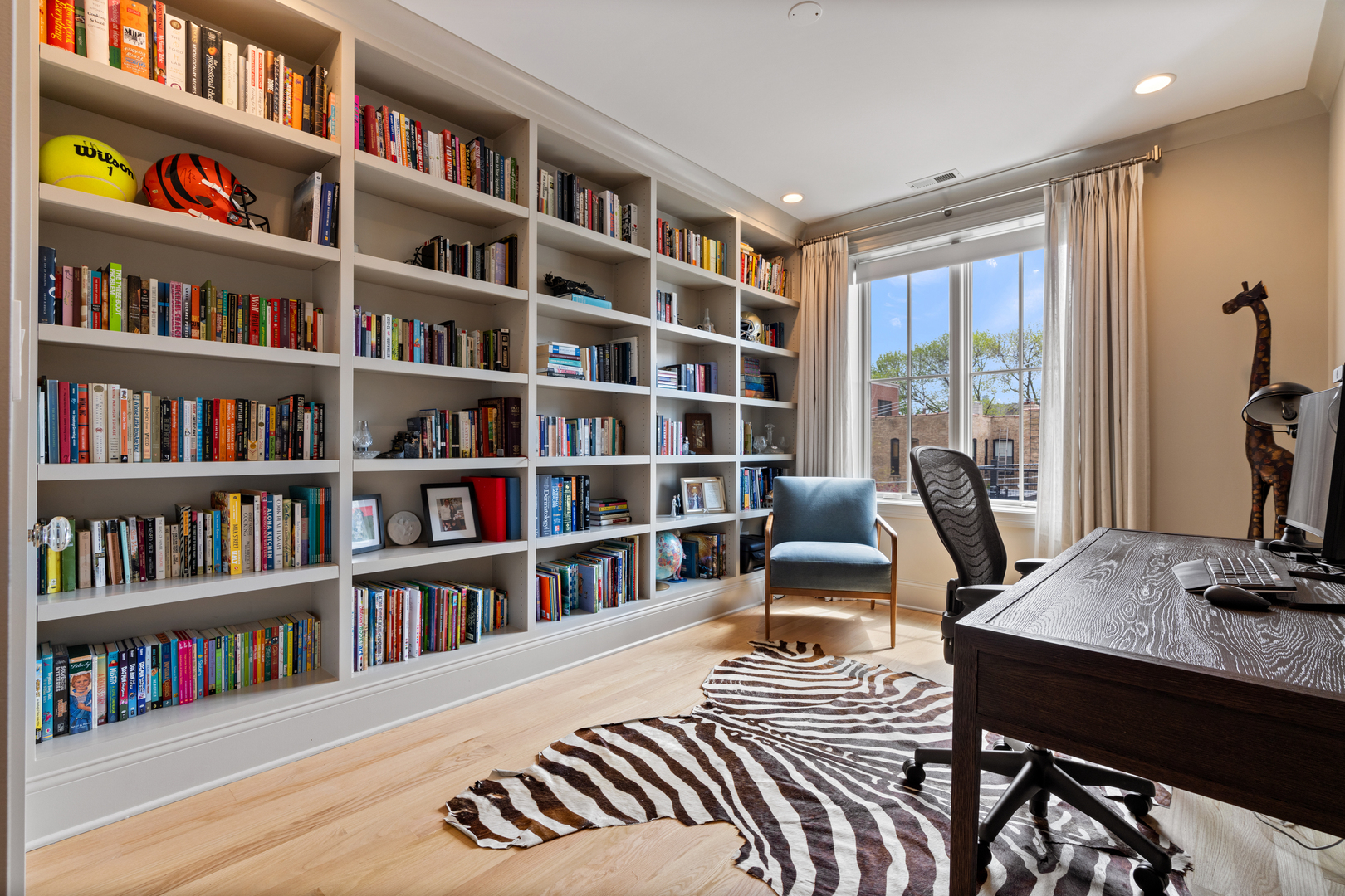 1025 West Altgeld Street Chicago, IL 60614 - Photo 23 of 41 a view of a workspace with furniture and a bookshelf