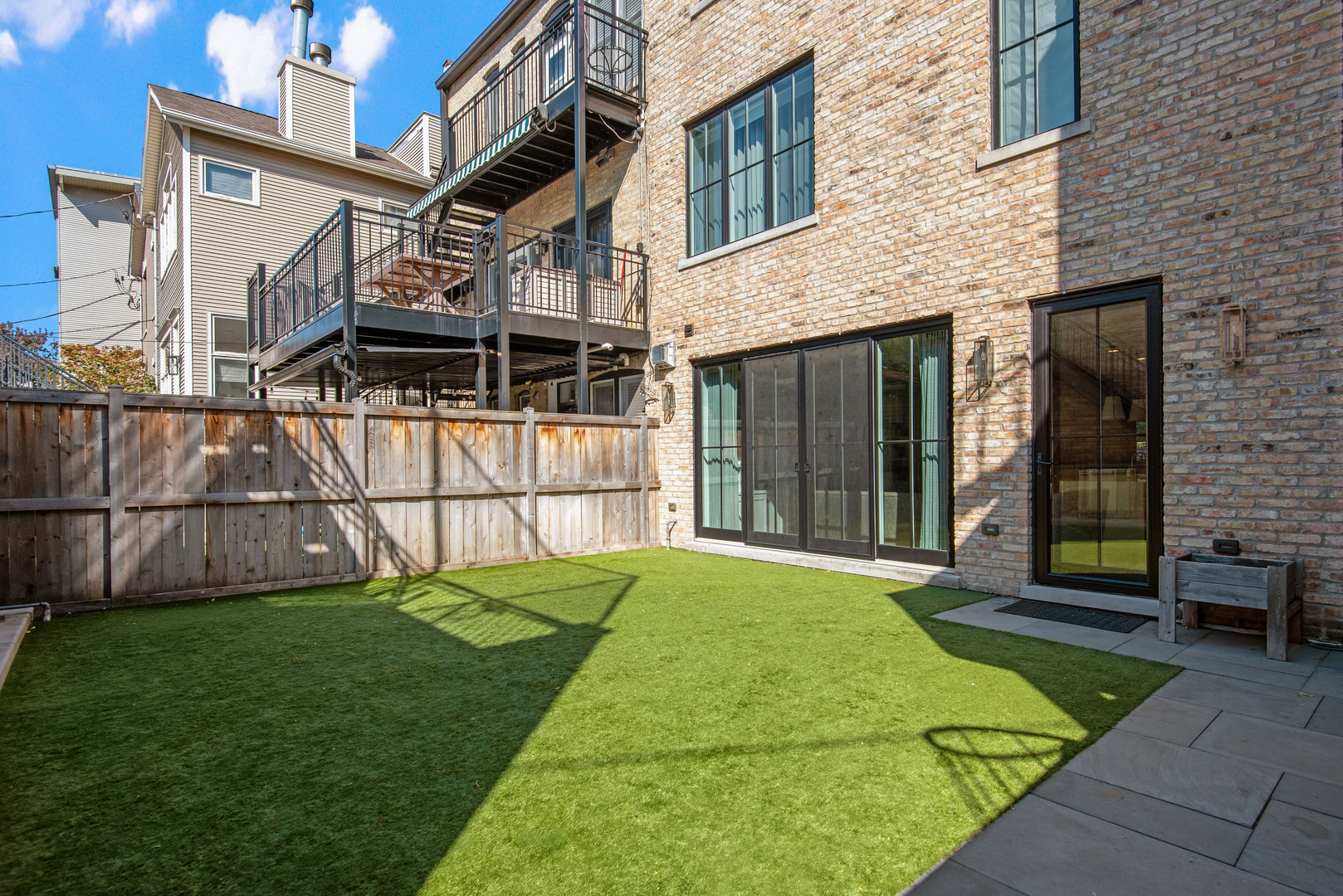 1025 West Altgeld Street Chicago, IL 60614 - Photo 36 of 41 a view of a house with a backyard