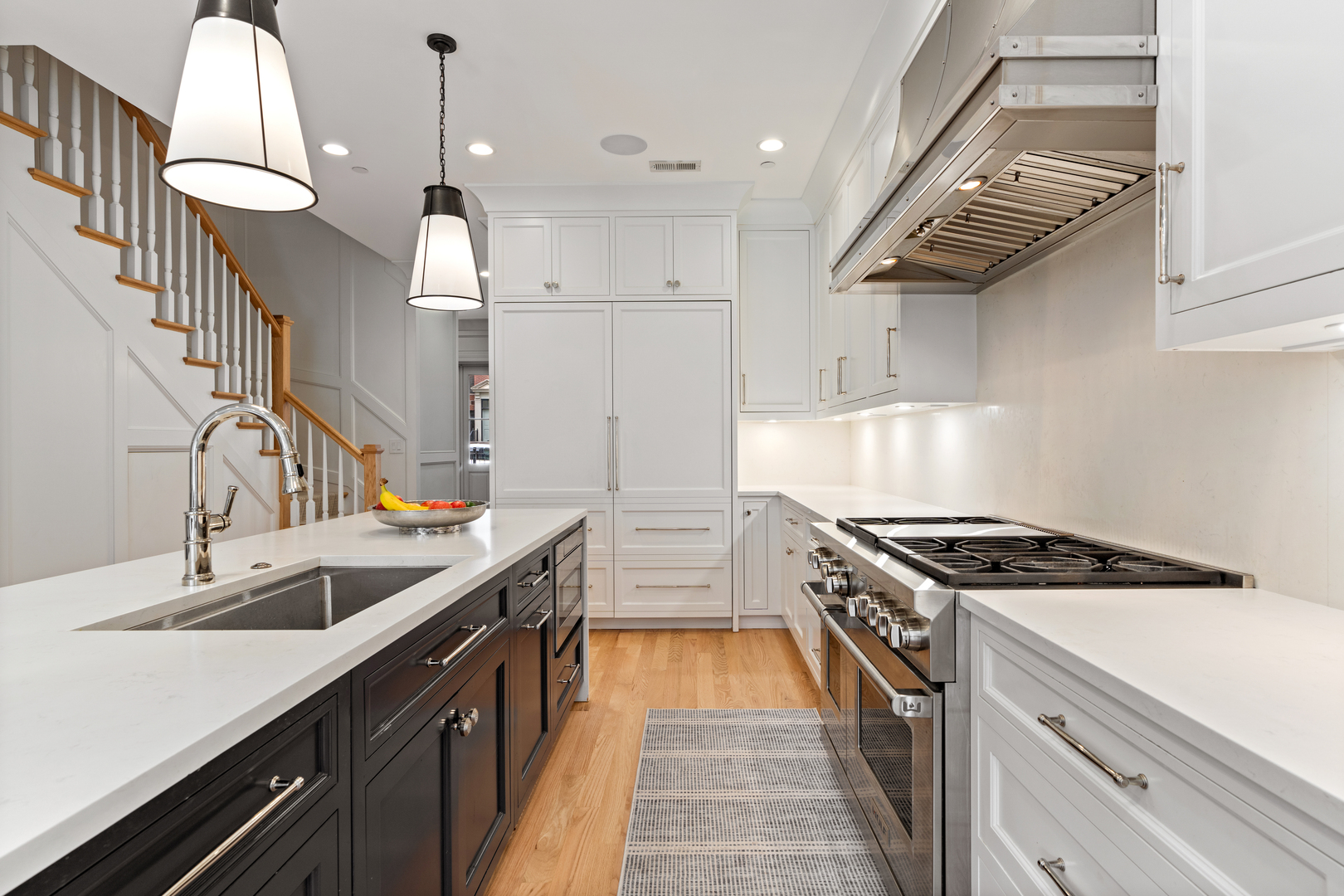 1025 West Altgeld Street Chicago, IL 60614 - Photo 9 of 41 a kitchen with granite countertop a sink a stove and a refrigerator
