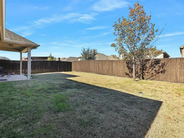 a swimming pool with wooden fence