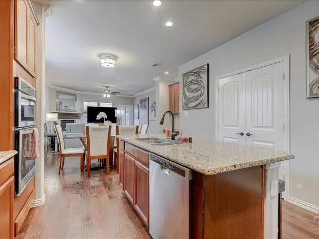 a view of a kitchen counter space and wooden floor