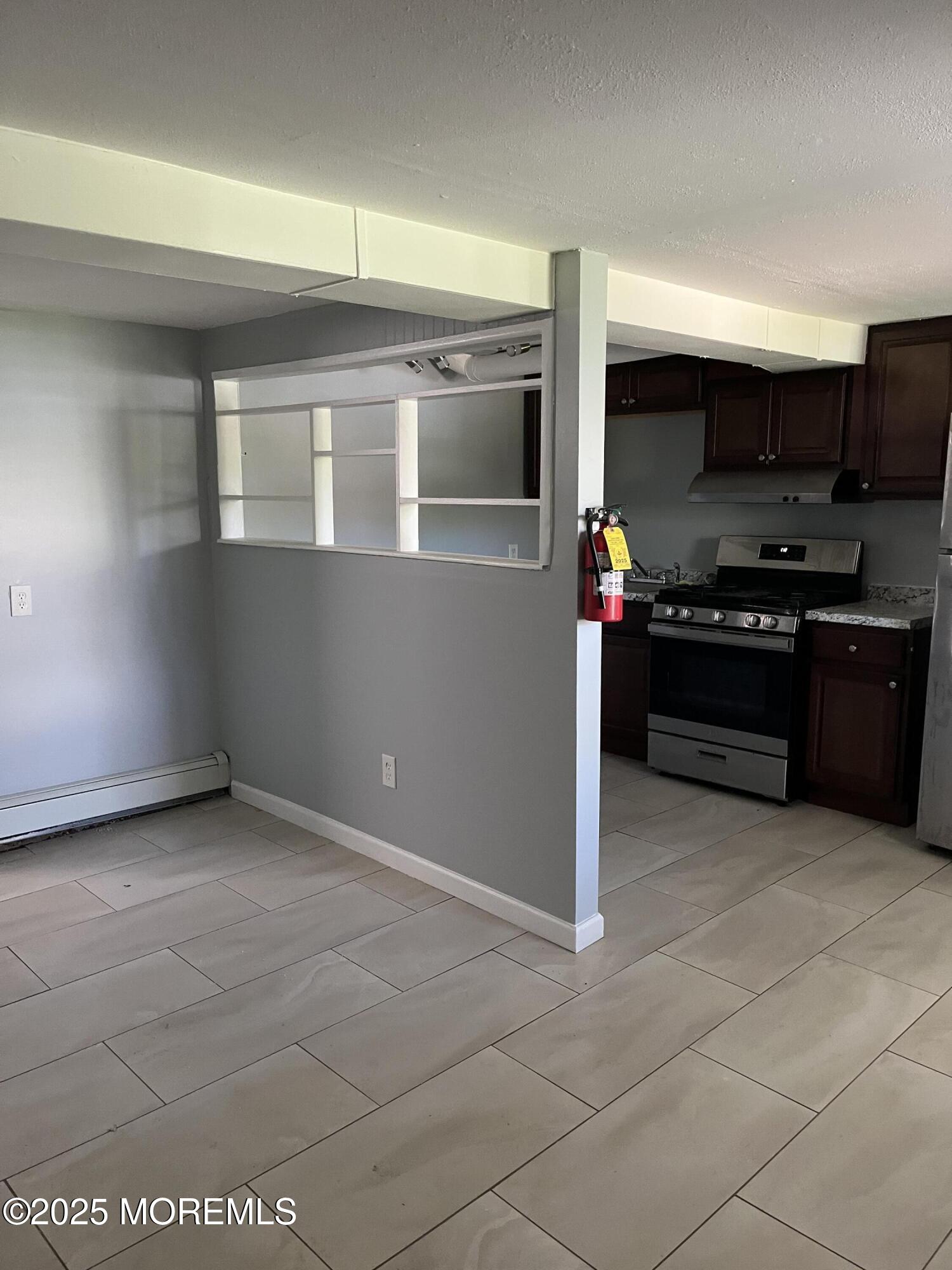140 Main Street Helmetta, NJ 08828 - Photo 2 of 5 a kitchen with stainless steel appliances granite countertop a refrigerator and a stove