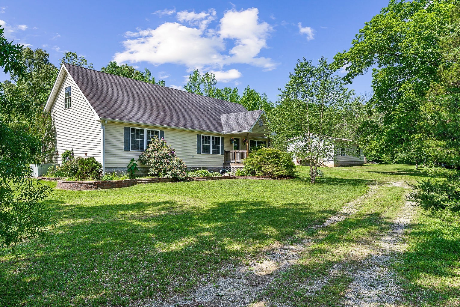 655 River Road Morrison, TN 37357 - Photo 4 of 53 a front view of a house with garden