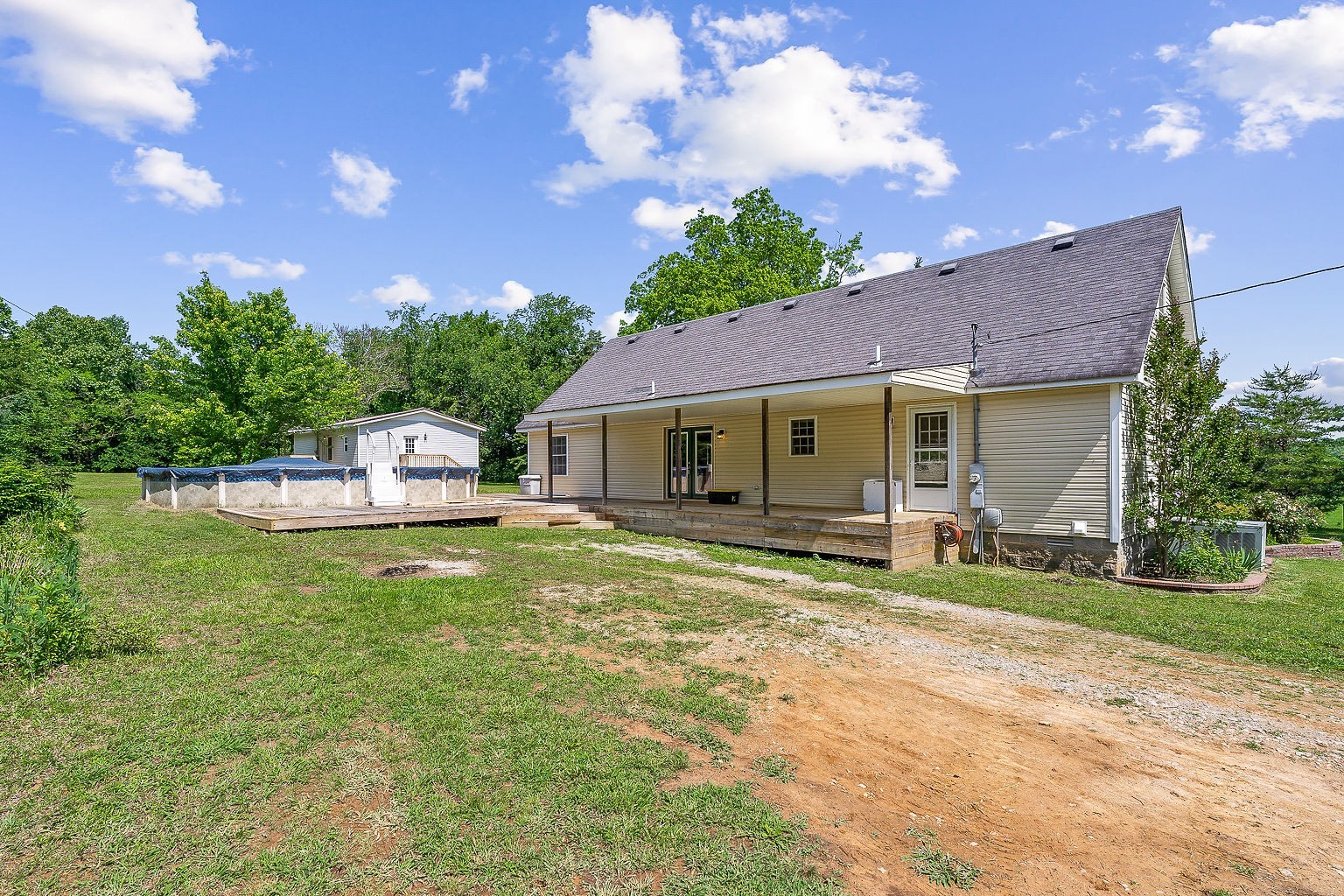 655 River Road Morrison, TN 37357 - Photo 6 of 53 a front view of a house with a garden and porch