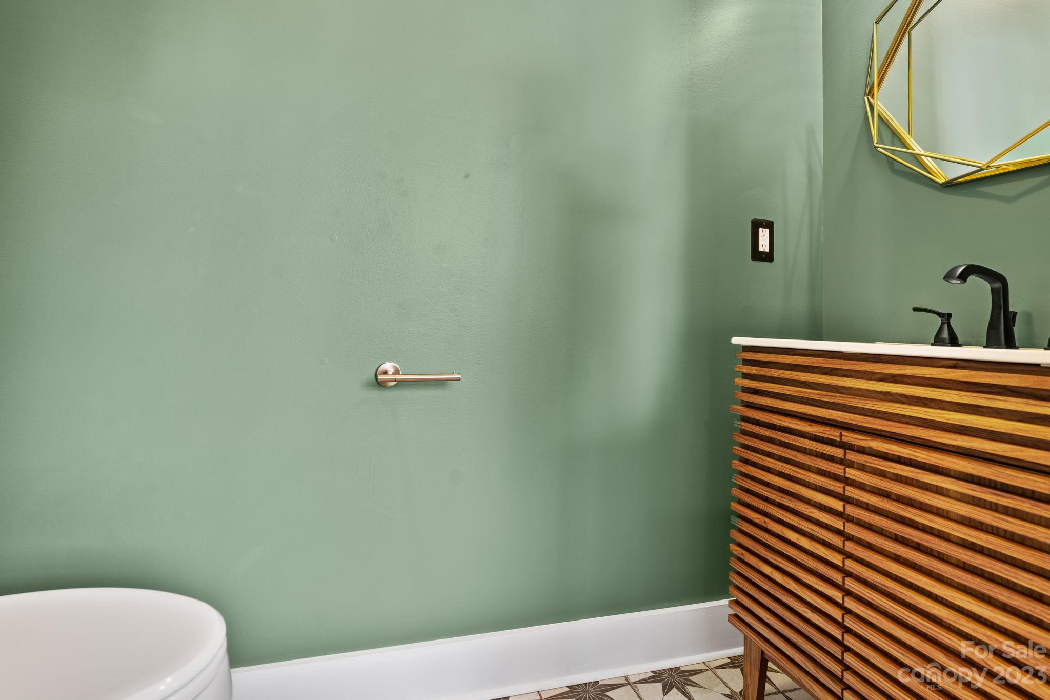 44 Reta Road Fairview, NC 28730 - Photo 11 of 36 a bathroom with a sink and a toilet