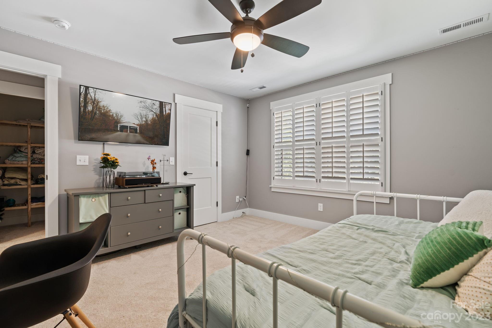 44 Reta Road Fairview, NC 28730 - Photo 27 of 36 a kitchen with a stove a sink and a refrigerator