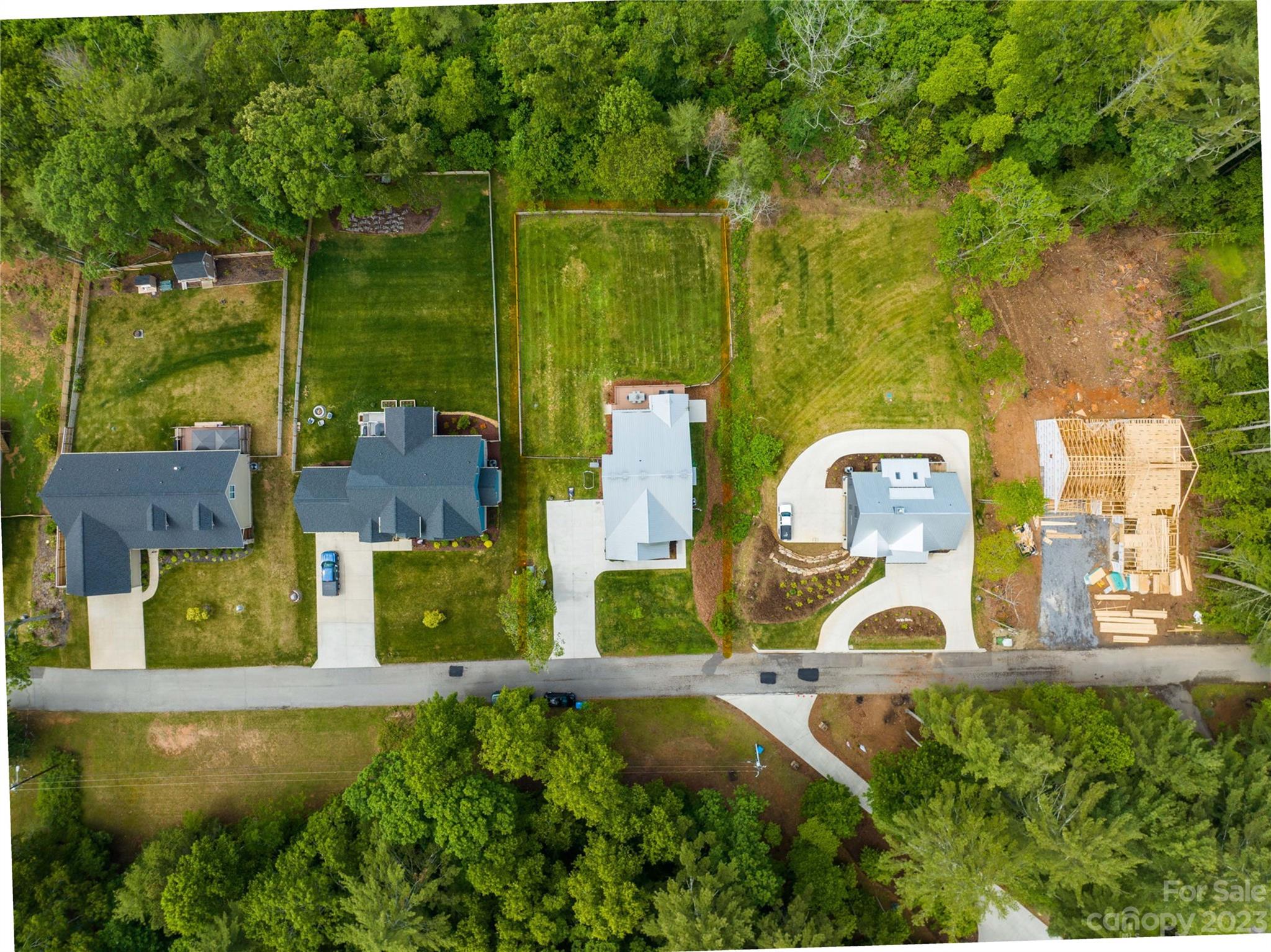 44 Reta Road Fairview, NC 28730 - Photo 36 of 36 an aerial view of a house with swimming pool and large trees