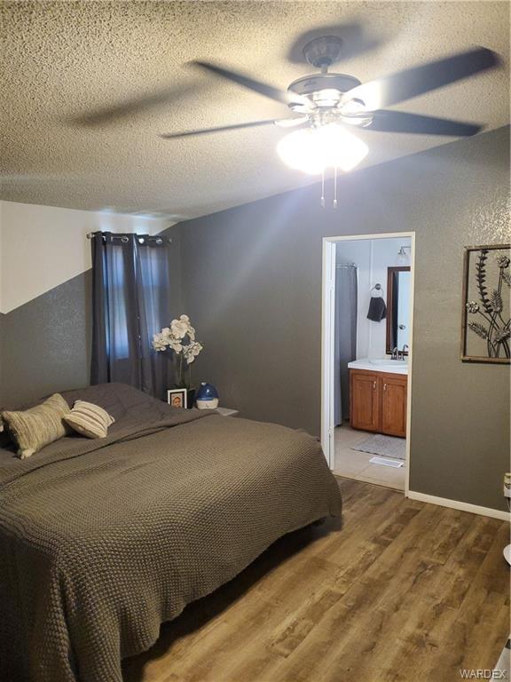 2277 Egar Road Golden Valley, AZ 86413 - Photo 15 of 28 a bedroom with a bed and window