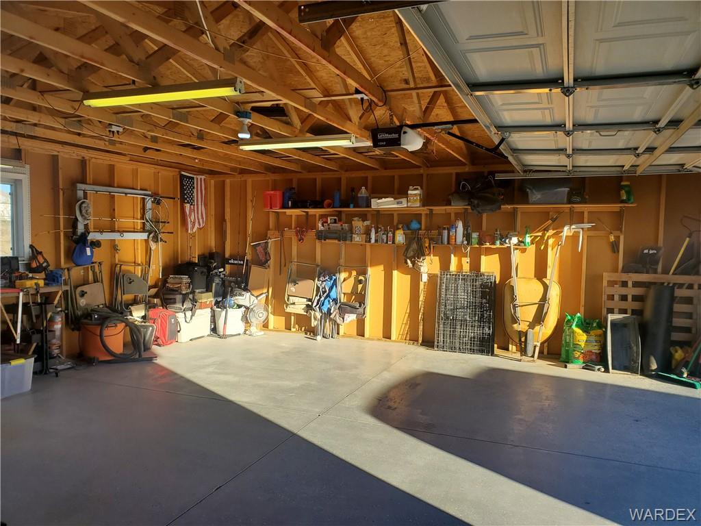 2277 Egar Road Golden Valley, AZ 86413 - Photo 20 of 28 a view of a garage with wooden walls