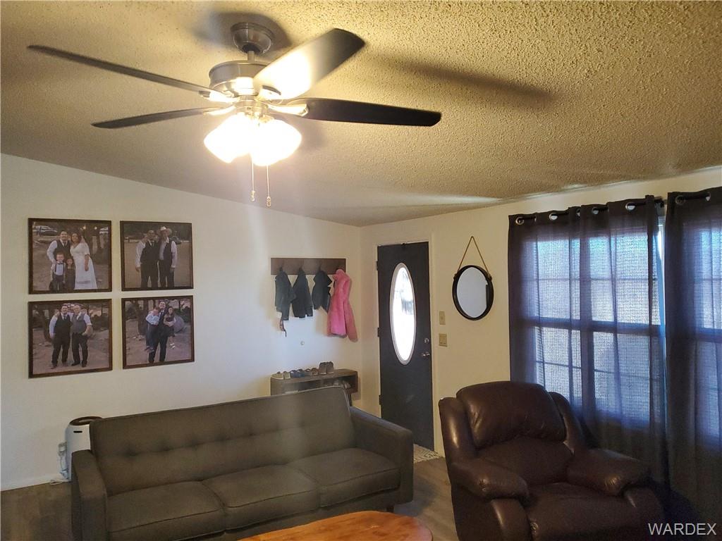 2277 Egar Road Golden Valley, AZ 86413 - Photo 5 of 28 a living room with furniture and window