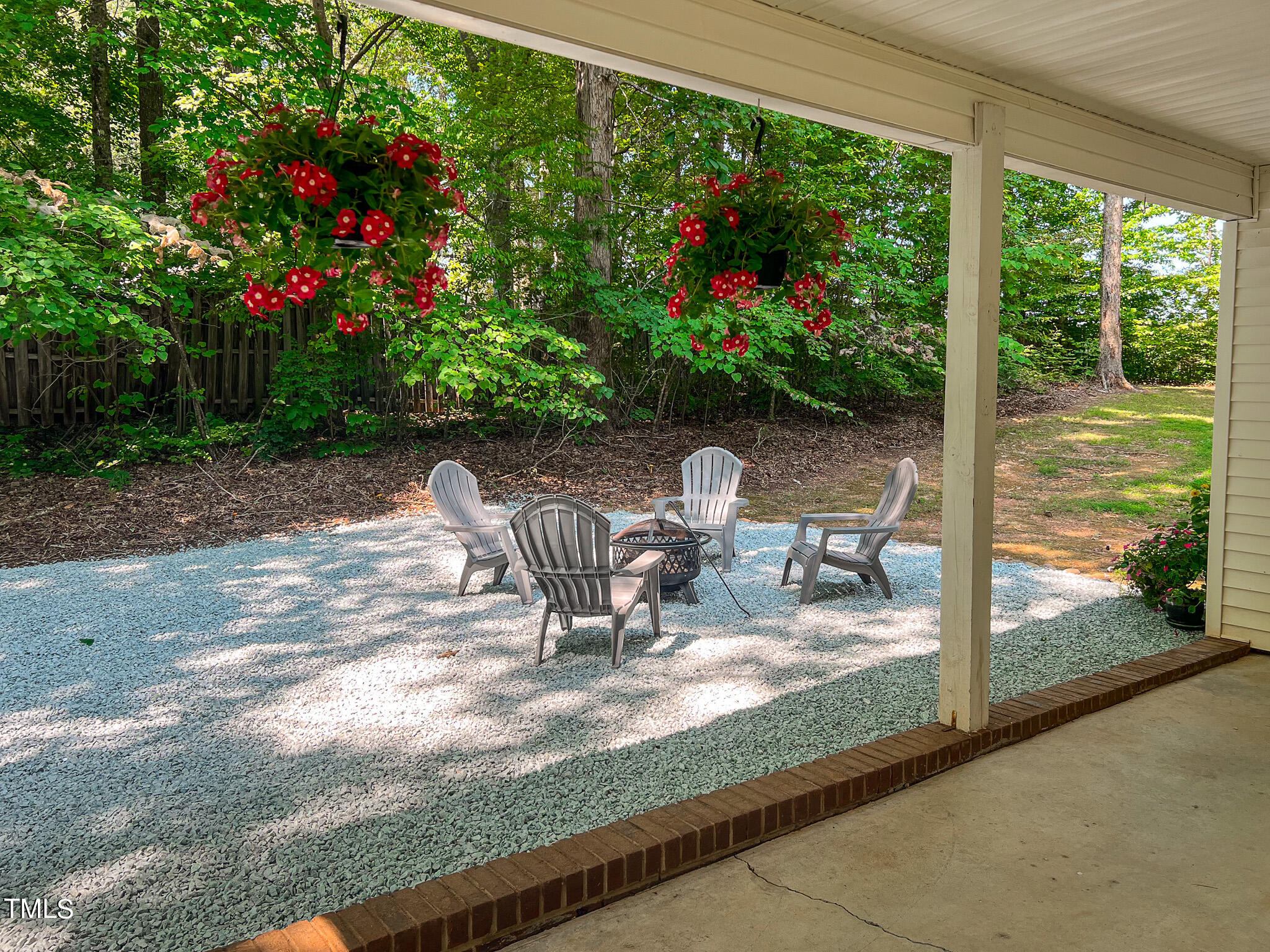 197 Cedar Creek Road Timberlake, NC 27583 - Photo 6 of 31 a view of a porch with chairs and backyard
