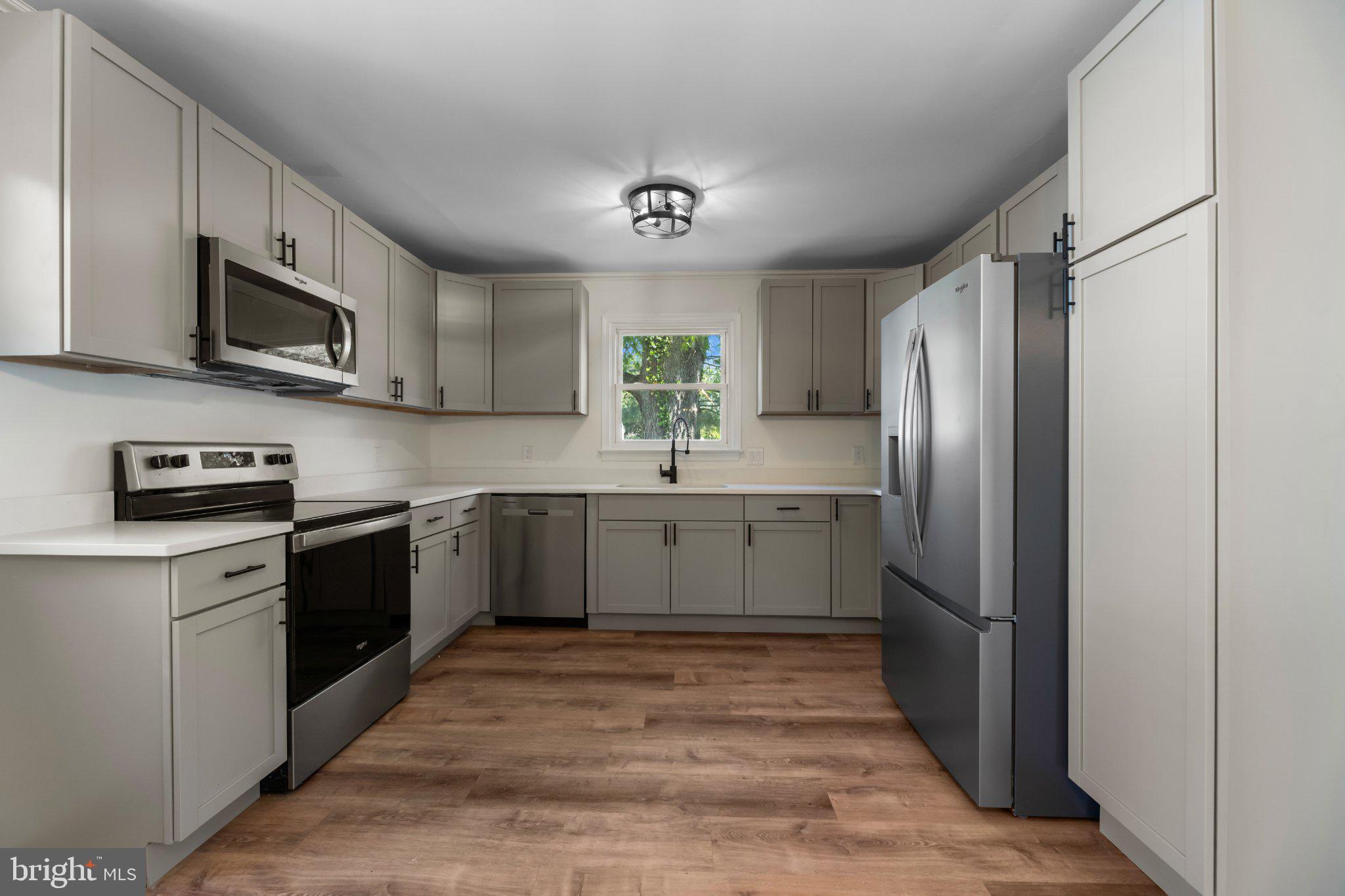 12 Oak Street Cambridge, MD 21613 - Photo 7 of 30 Modern kitchen with sleek finishes.