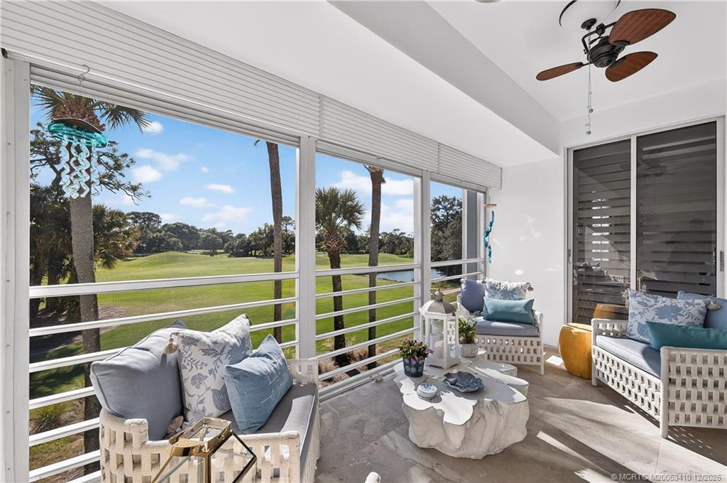 12445 Harbour Ridge Boulevard, Unit 38 Palm City, FL 34990 - Photo 11 of 46 a living room with furniture and a large window